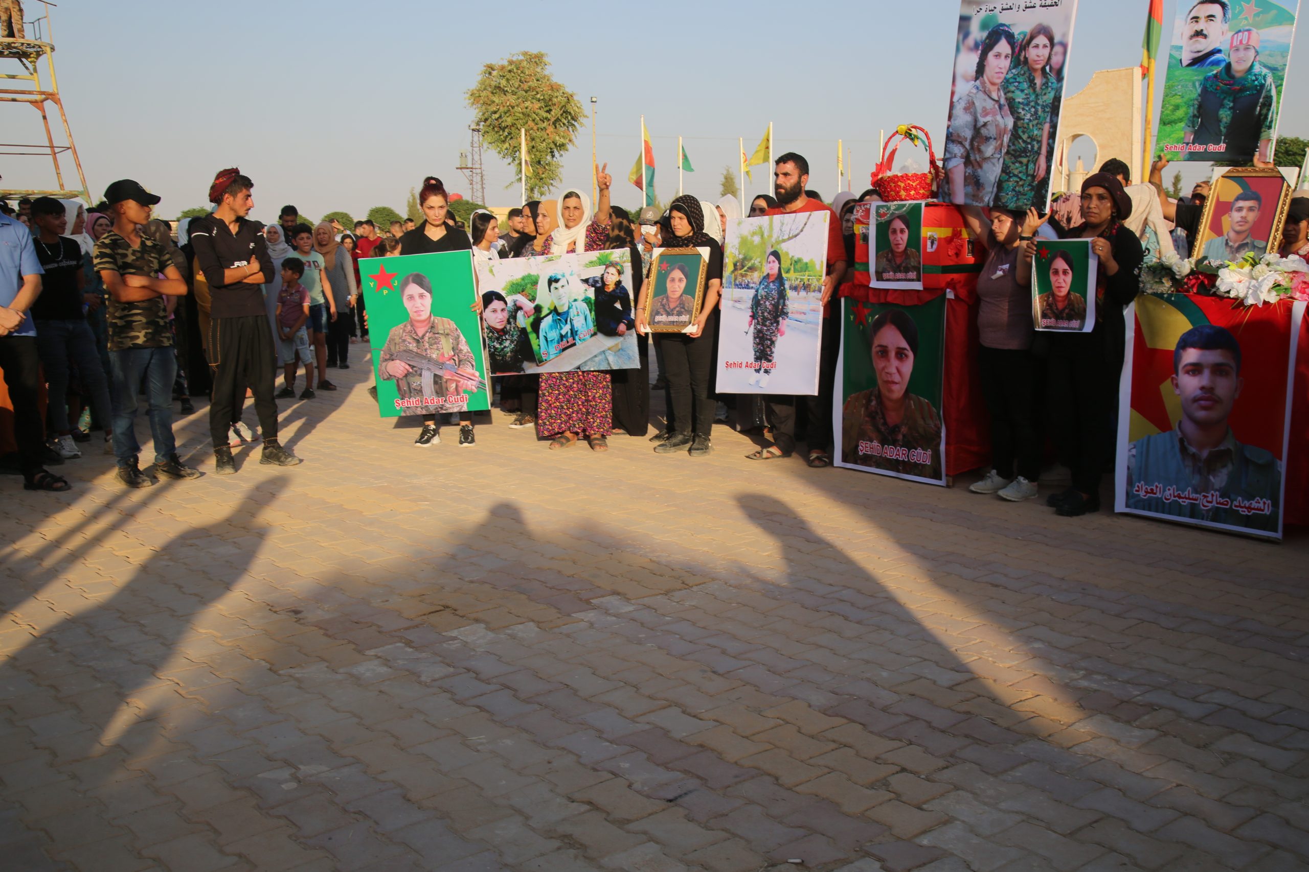 The people of Al-Hasakah city spread the bodies of the heroic martyrs to their final resting plac