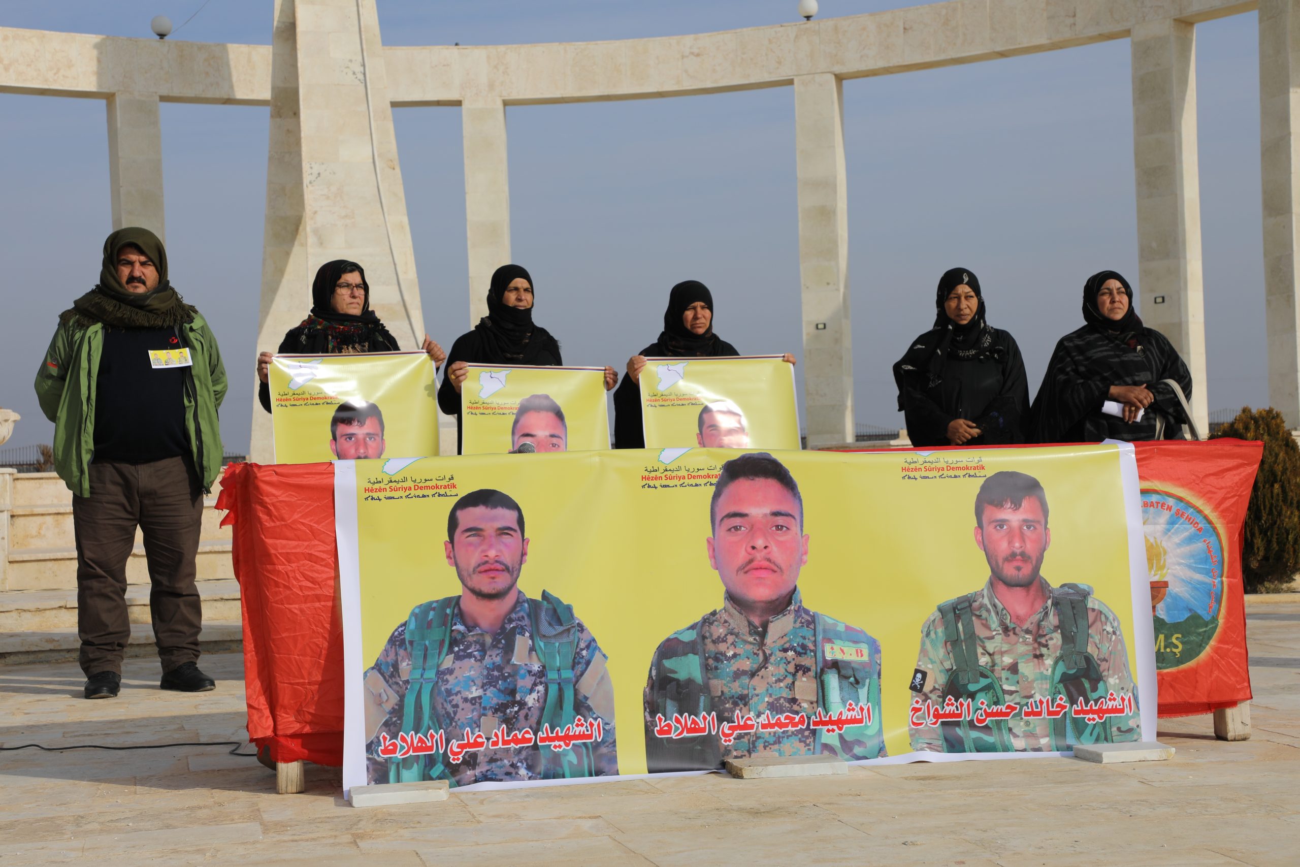 People in the city of Raqqa mourn three martyrs of their righteous sons at the Shrine of Dignity.