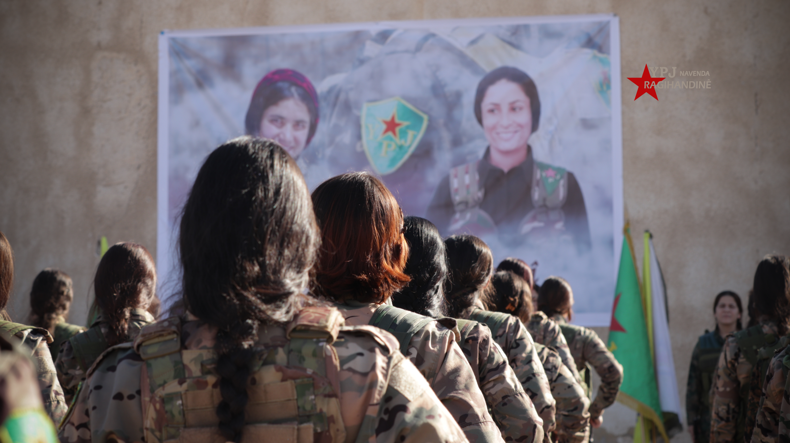 Commemoration of Martyrs Arîn Mîrkan and Rivana Rojava with a Military Ceremony
