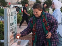 On the Occasion of Martyrs’ Day, Residents of Qamishlo Light Candles at the Graves of the Martyrs.