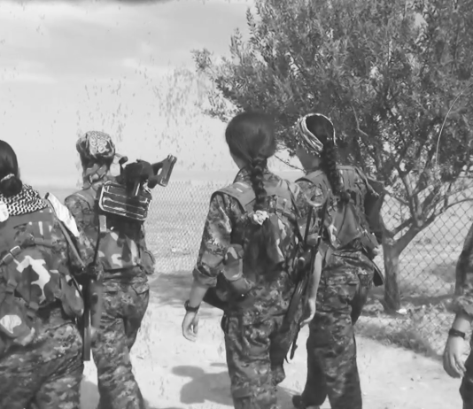 The weapon on the shoulder of a YPJ fighter guarantees a life of freedom and equality.